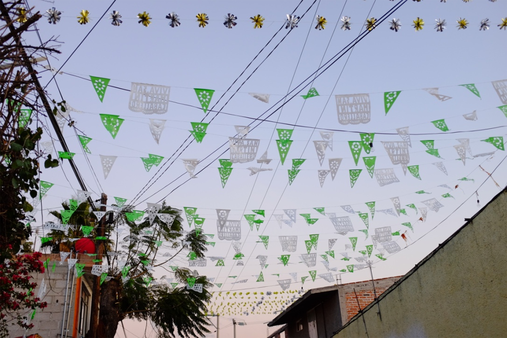 Paper garlands against a twilit sky